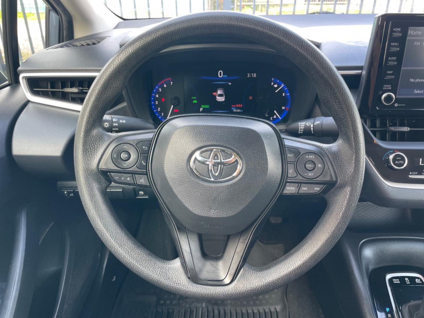 2022 Blue /Silver Toyota Corolla LE (JTDEAMDEXNJ) with an 1.8L Hybrid engine, Automatic transmission, located at 1501 West 15th St., Houston, 77008, (713) 869-2925, 29.797941, -95.411789 - Photo#9